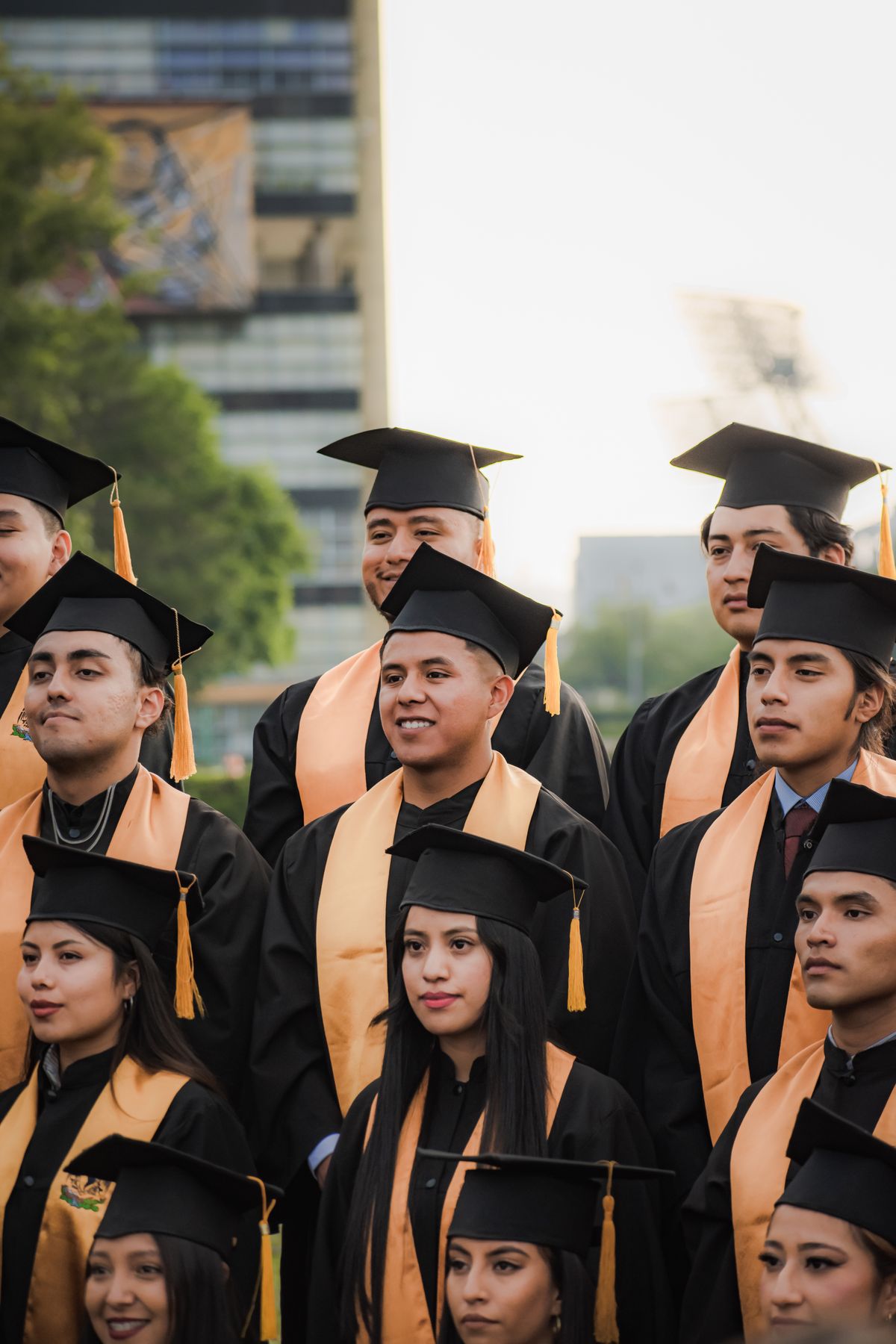 Group of international students celebrating graduation outdoors
